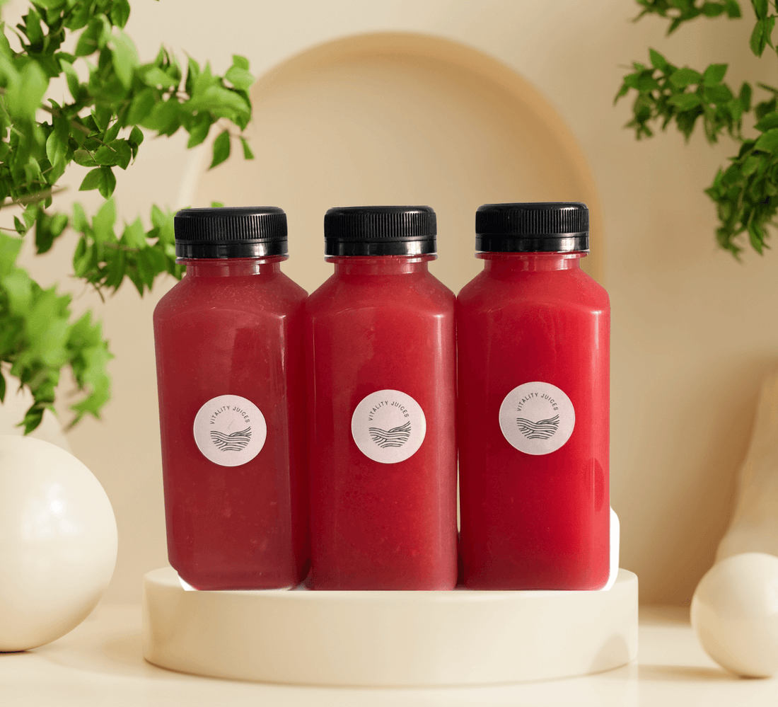 Three bottles of Vitality Juices' Nature’s Gatorade Juice, made with watermelon and rich in lycopene, displayed against a fresh, natural backdrop.